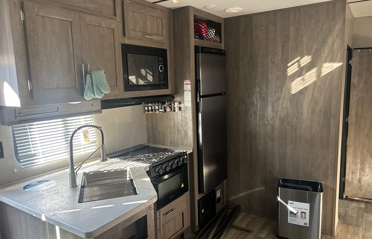 Kitchen with a full size refrigerator