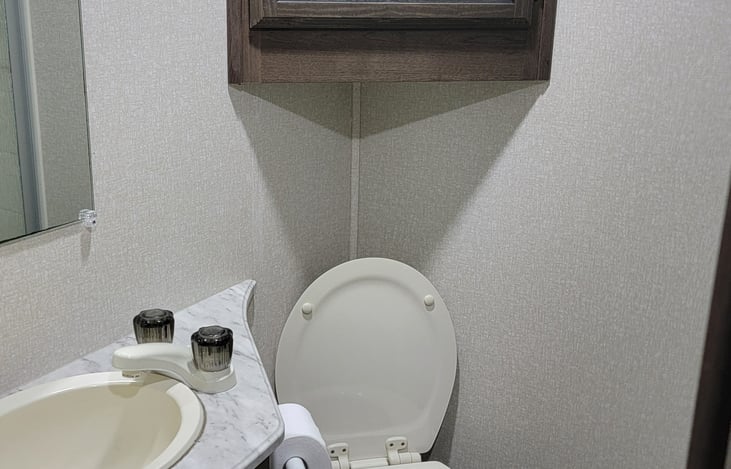 Bathroom featuring new ceramic toilet