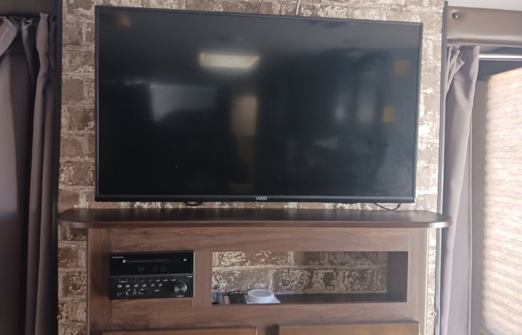 Tv with fireplace below