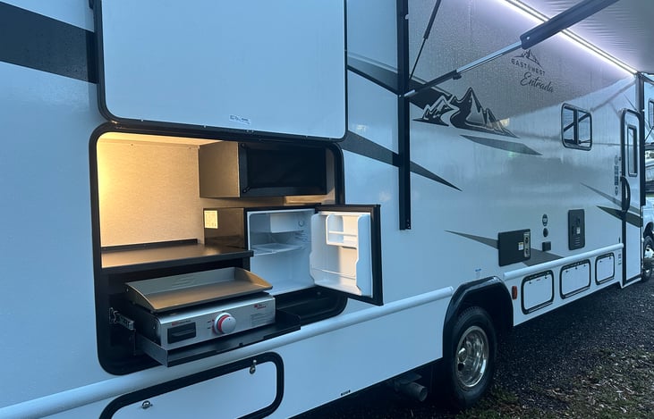 Outdoor Kitchen includes Griddle and Mini Fridge