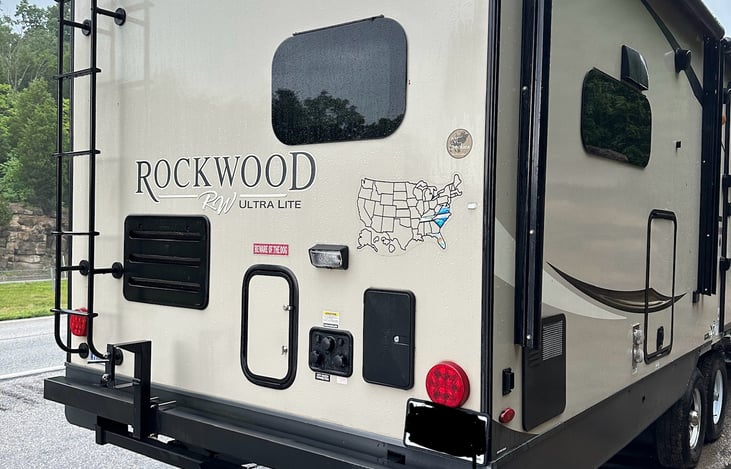 Outdoor shower at rear of camper.