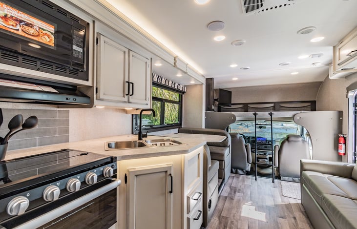 Spacious kitchen and Dining/living area. View of MID Cab of RV.