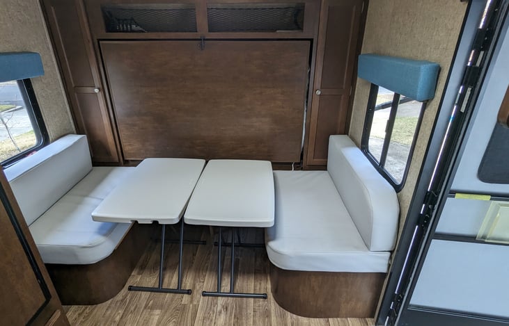 Newly-reupholstered dinette with added bench at back for kids. Adjustable height indoor/outdoor tables have more flexibility than the original table.