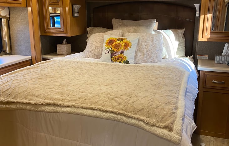 Queen size bed also has access to TV and sliding door for more privacy.  Phone chargers and outlets provided.