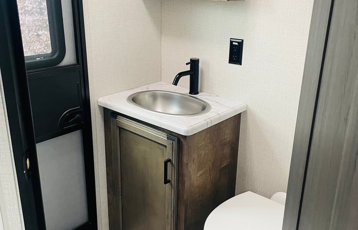 Spare bathroom with sink and toilet. Can access this from exterior door or inside.