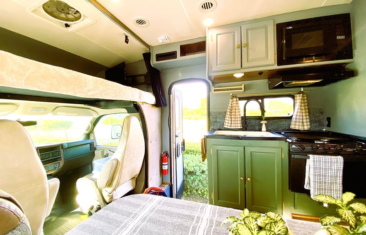 Fully equipped kitchen inside our motorhome rental — experience the freedom of RV life with unlimited mileage.