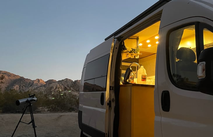 Van exterior at night with lights on