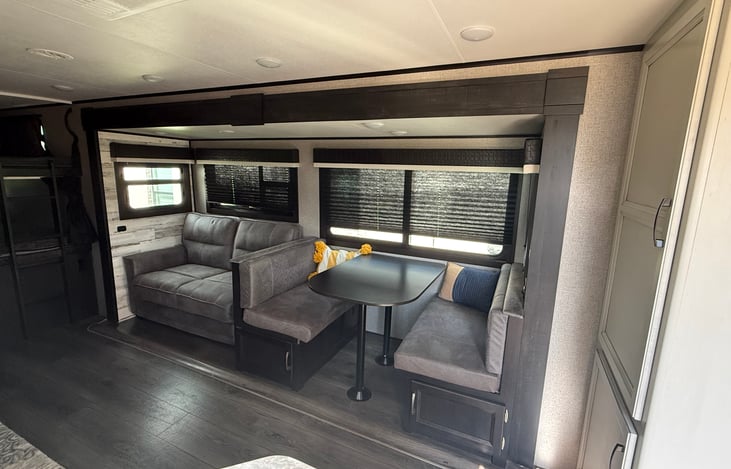 Couch and table with large windows