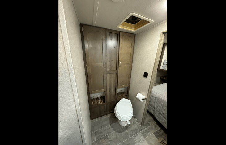 Main restroom with towel storage.