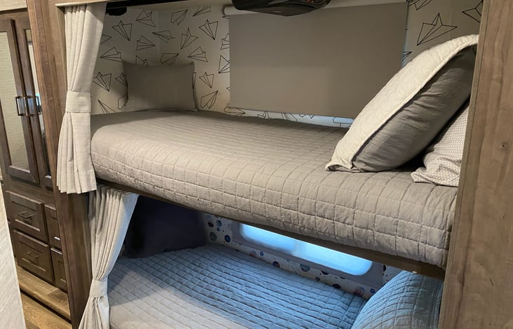 Bunk beds with cd/dvd player, privacy curtains and upgrade to premium memory foam mattresses.