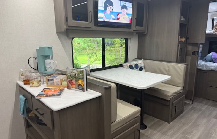 Bench seating for dining, coffee station, and recipe books in case you need some inspiration!