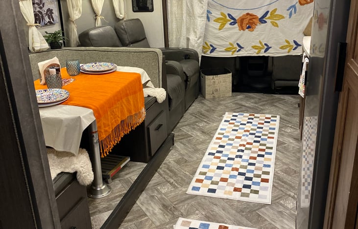 Good view of dining room table and theater chairs