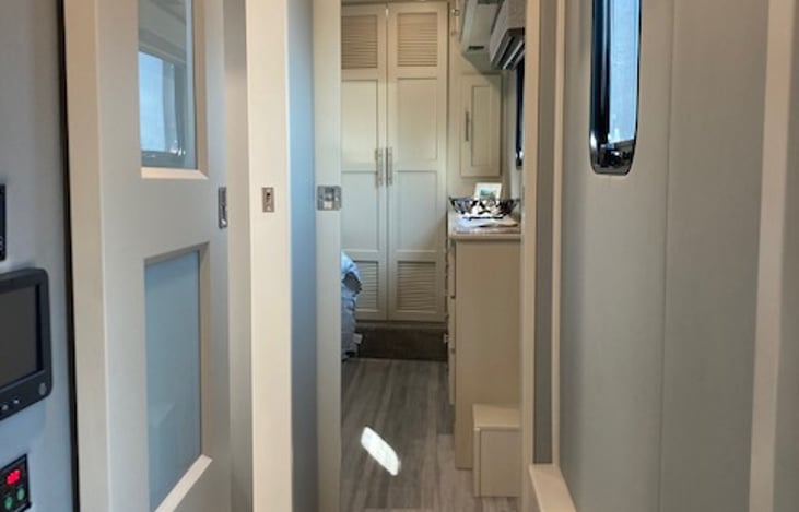 Stairs and hall to front master bedroom and shower