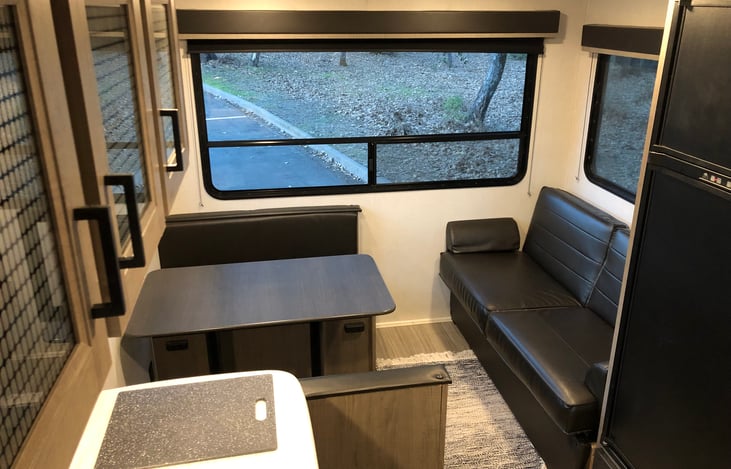 Living and Dining area plus Roku TV (Both couch and table convert to beds 60"x40")