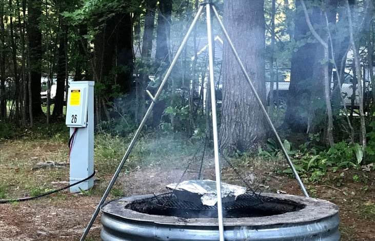 This spinning tribod for campfire cooking is in the camper