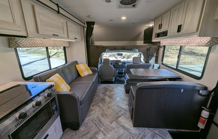 Spacious, bright & modern interior. Well-stocked kitchen with stove-top and convection microwave. Comfy couch and dinette both convert to beds. Large overhead bunk with swing-out TV for entertainment.