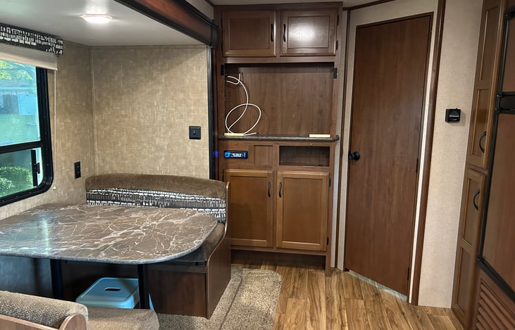 Dinette turns into small bed that will fit 1-2 kids, or 1 adult. Storage available under the seats.