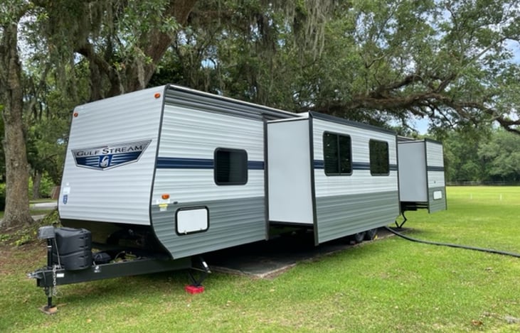 Drivers side showing slide outs fully extended for the wedding event in Gautier, MS