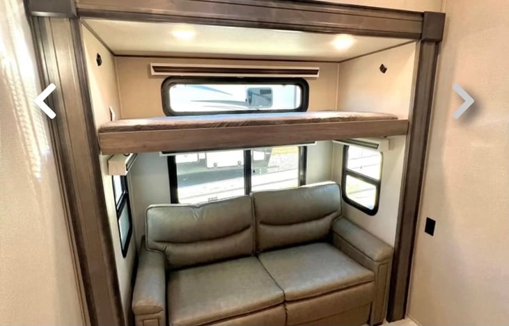 Extra bedroom features a bunk bed as well as a pull out bed couch.