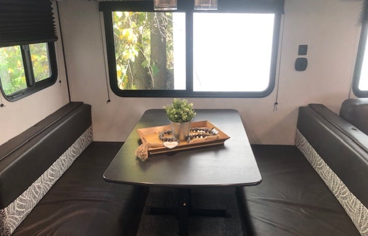 Dining table folds down for sleeping.