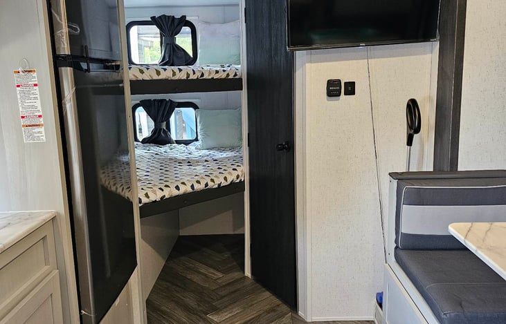 View from the couch - Behind the door is the bathroom.