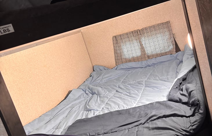 Fresh made bottom bunk bed. Extra sheets, blanket, pillows, and cases are always on the top bunk for customer use.