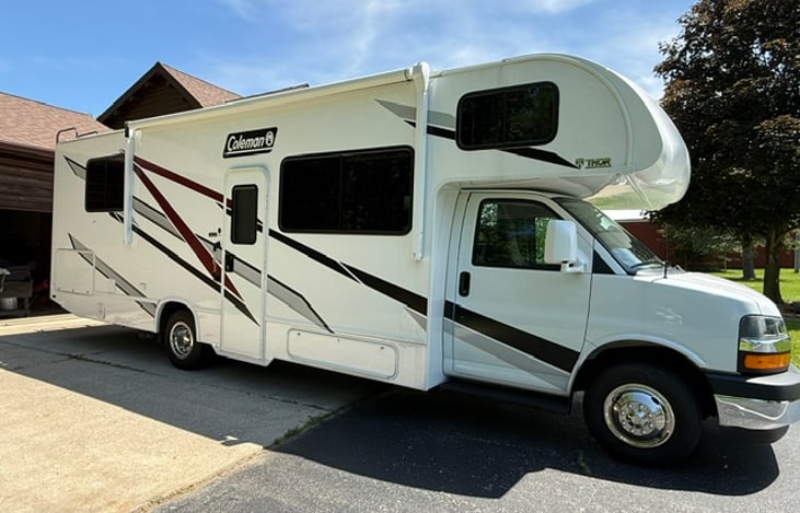 2024 Thor Motor Coach Coleman. Storage seen here is to the lower right of door and a huge storage cavity in the back.