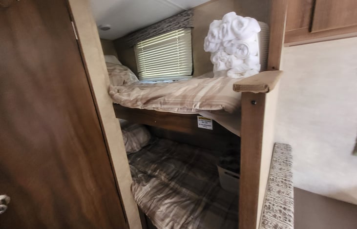 Bunk beds each have a light