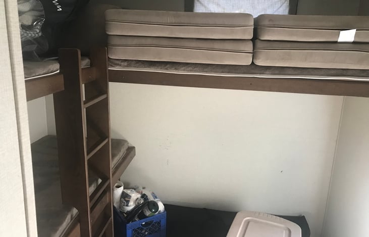 Bunkhouse is the rear.  3 bunk beds plus 2 fold out beds.  We personally when using our second home have a dog crate in that open area for one of our Newfoundland fur babies