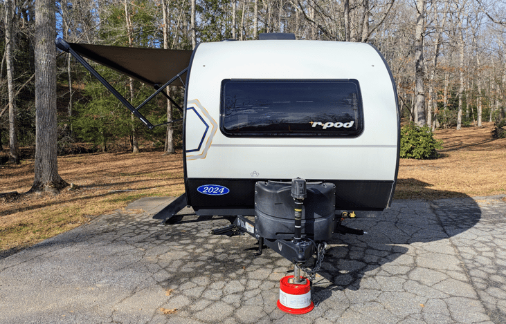 Experience luxury in this 2024 R-Pod 204! Loaded with modern amenities and technology, this whimsical camper features a walk-through bath, a queen-bed slide, on-demand water heater, solar power, inver