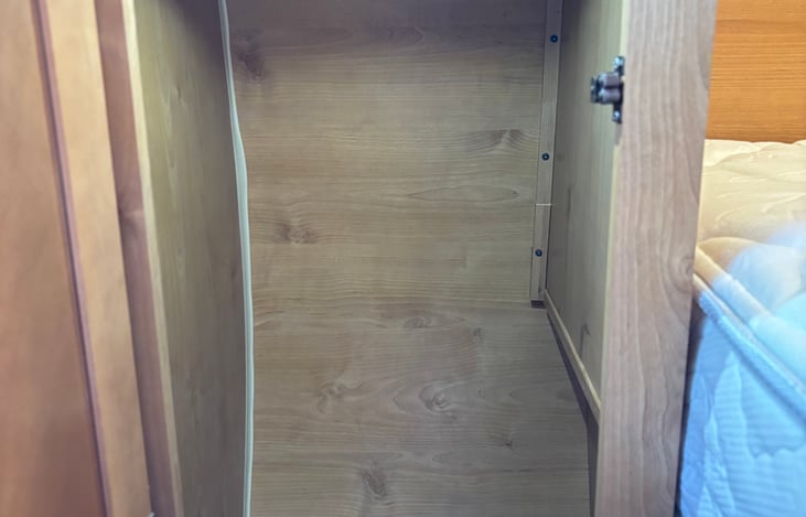 1 closet with hanging rod, can see upgraded thicker mattress here