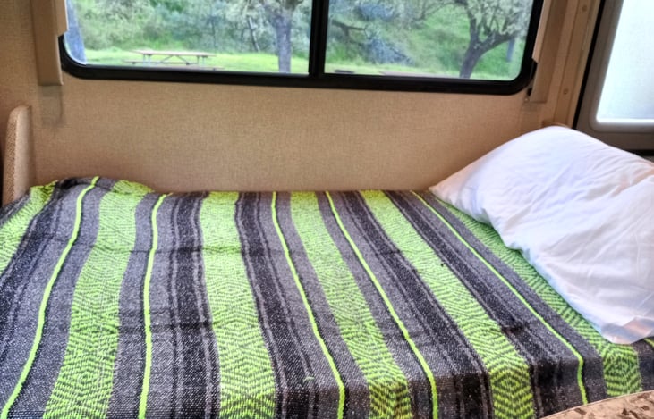 The couch folds down to a bed you can find a memory foam topper stored under the seat. Also sheets and blankets..