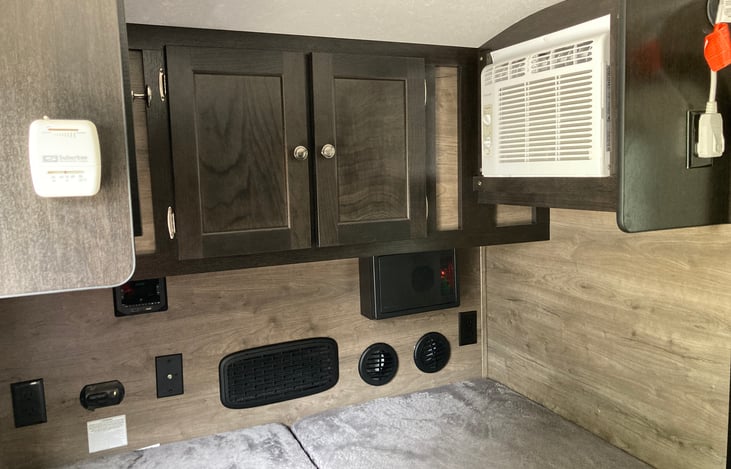 The storage cabinets keep your sleeping are clean. The air conditioner works great and cools the space down in minutes. Better yet, the open windows and ceiling fan provide great airflow.