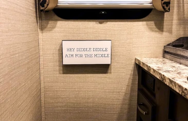 sign over the toilet