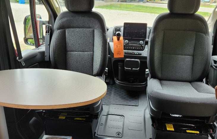 Front bucket seats/GPS/dining area.