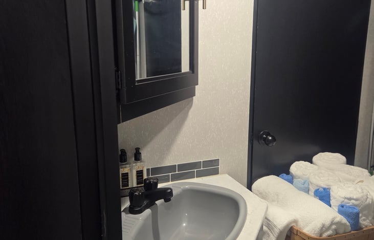 Fully stocked bathroom, bath towels, hand towels, wash cloths, bathmat, hamper, RV TP, PH items, first aid kit and much more