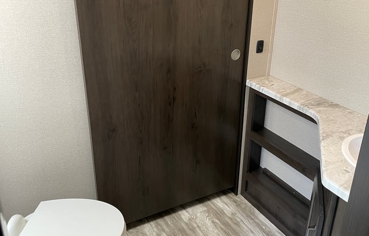 Passthrough bathroom with access from master and main cabin