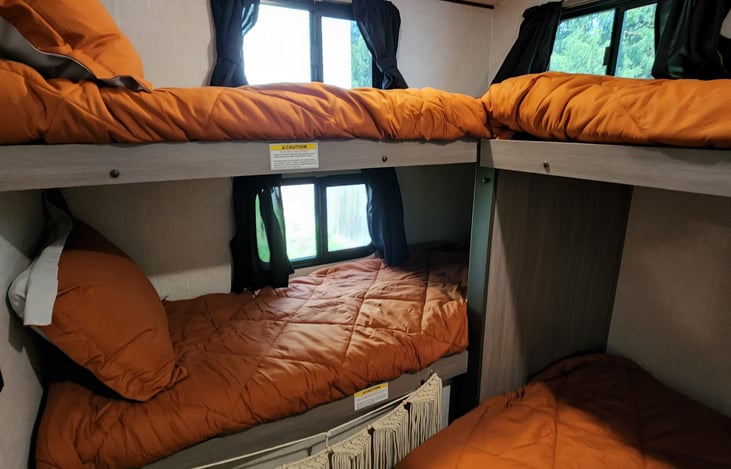 All bunks will fit a person 300 pounds and up to 6ft 4inches tall.