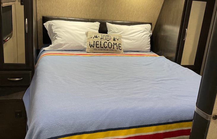 Private bedroom with sliding bedroom door, separate door to exterior and queen size bed.