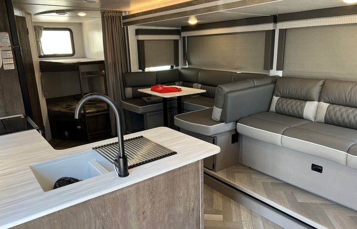 Kitchen/living area. Bunks in corner.