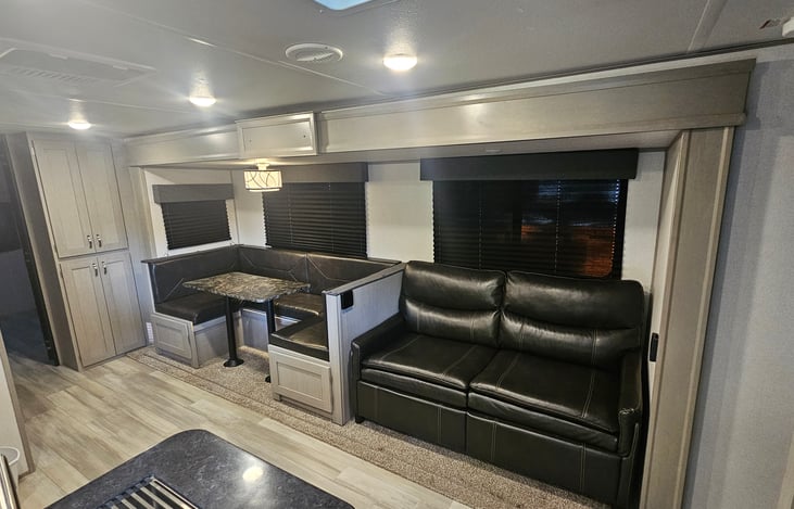 Love seat with a pull out bed for sleeping 2 people.
Dinette that converts to a sleeping area for two.