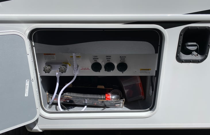 Water and sewer. The sewer hose and gloves are there.