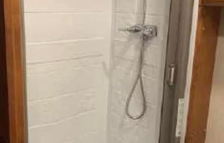 bathroom has shower that you can actually turn around in!