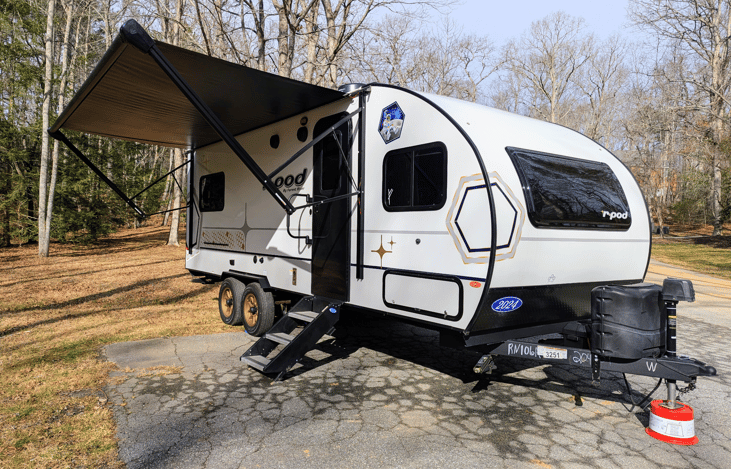 Experience luxury in this 2024 R-Pod 204! Loaded with modern amenities and technology, this whimsical camper features a walk-through bath, a queen-bed slide, on-demand water heater, solar power, inver