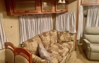 A 5th wheel travel trailer suited for 2 people