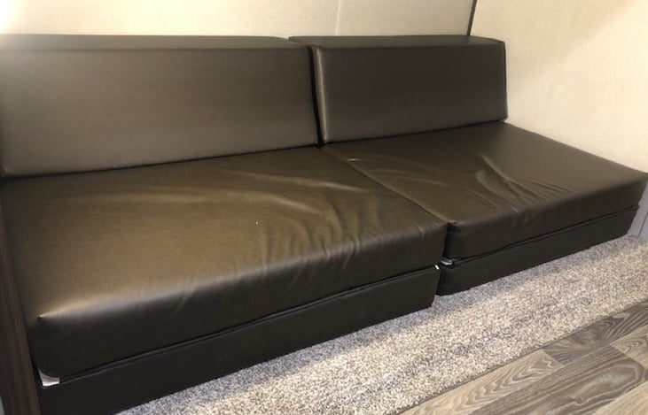 Couch in bunk house folds out to sleep two