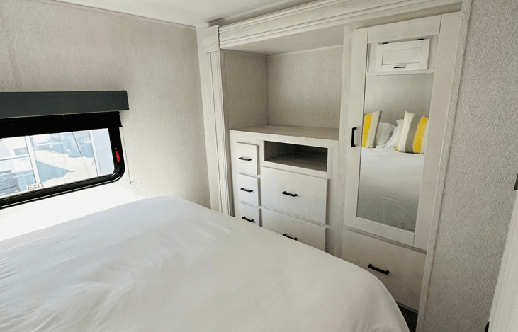 A dresser with hangers and cabinets for your wardrobe!