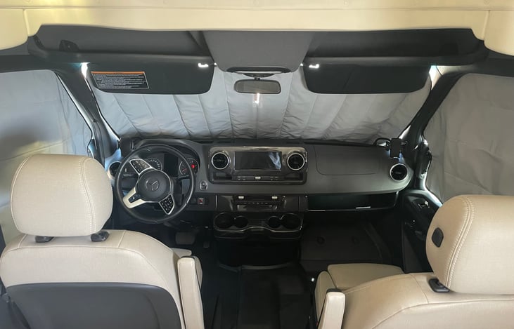 Modern Mercedes cockpit with heated power seats and many safety and comfort features.