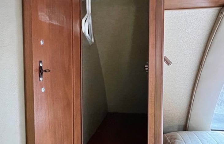 Closet space on both sides of bed.