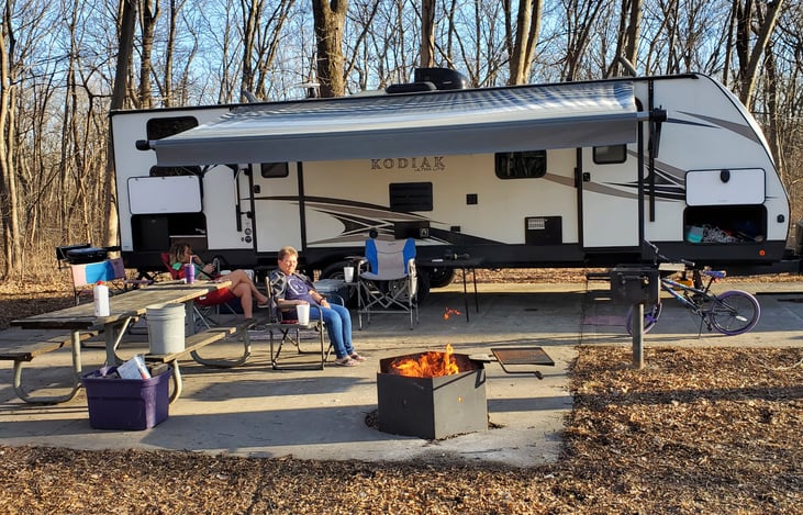 Our first trip 2022, Watkin's Mill State park. Two side storage areas, Gas grill on back bumper. Sm. fridge and sink in back storage compartment. Front compartment goes entire width of unit.